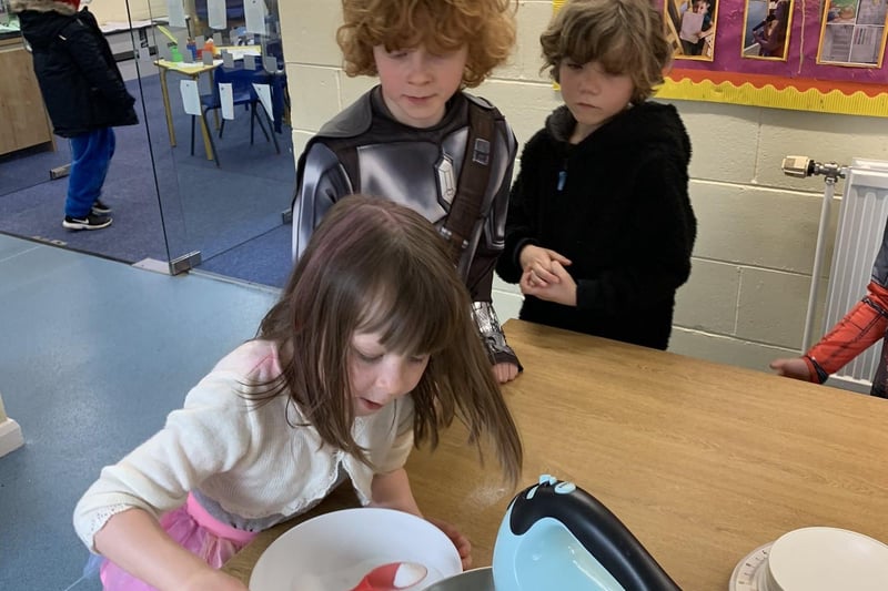 Year 1 pupils at Winchelsea School testing the meringue mix in Red Nose Day activities. EMN-210320-112925001
