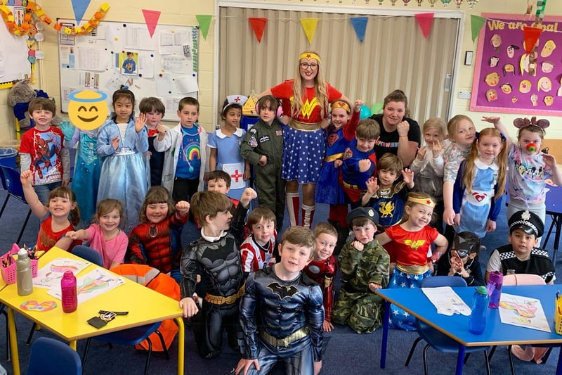 Year 1 class at Winchelsea School showing their hero status on Red Nose Day. EMN-210320-115740001
