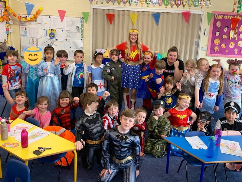 Year 1 class at Winchelsea School showing their hero status on Red Nose Day. EMN-210320-115740001