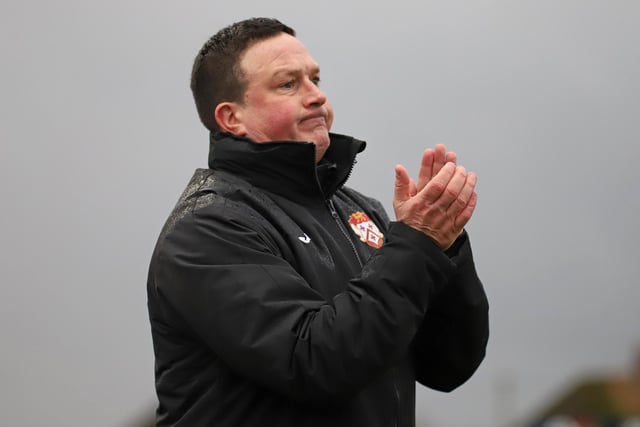 Paul Cox applauds his Poppies team from the sidelines