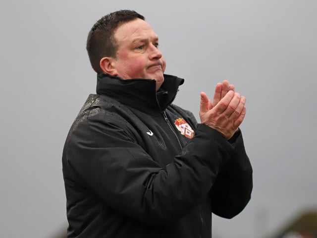 Paul Cox applauds his Poppies team from the sidelines