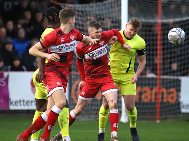 The two captains Connor Kennedy and Gaz Dean battle for the ball