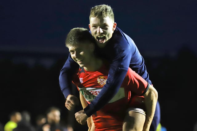 Kettering players Connor Johnson and Jordon Crawford show their delight at the final whistle