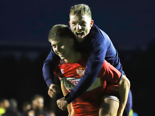 Kettering players Connor Johnson and Jordon Crawford show their delight at the final whistle
