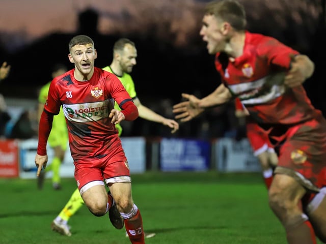 Harrison Neal heads off to celebrate after he scored the Poppies' third goal