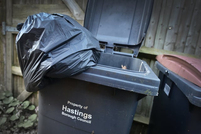 File: Black rubbish bin Hastings Borough Council. SUS-220202-083054001