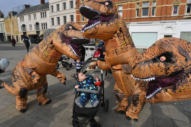 Inflatable dinosaurs roaming the City Centre to publicise the T.Rex:The Killer Question event at Peterborough Cathedral in July EMN-220303-151157009