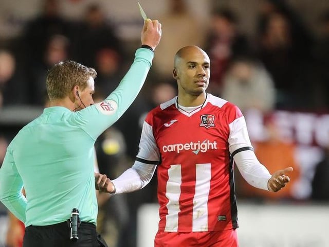 Jake Caprice of Exeter City is shown a yellow card.

Photo: Getty Images