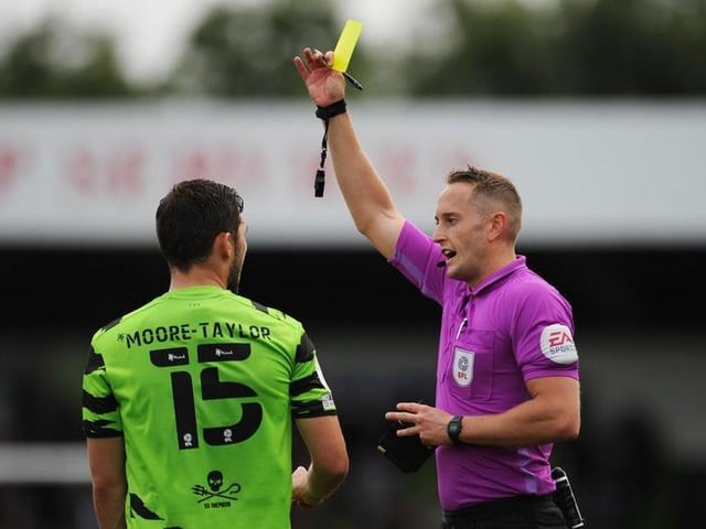 James Bell shows a yellow card to Jordan Moore-Taylor. The leaders have had 46 yellow cards and one double booking this season.

Photo: Getty Images