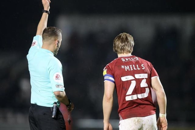 Joseph Mills of Northampton Town is shown a yellow card by referee Paul Howard.

Photo: Getty Images