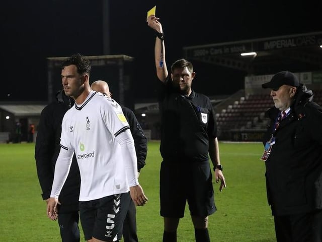 Harrison McGahey is shown a yellow card by referee Brett Huxtable at the the final whistle.
Photo: Getty Images