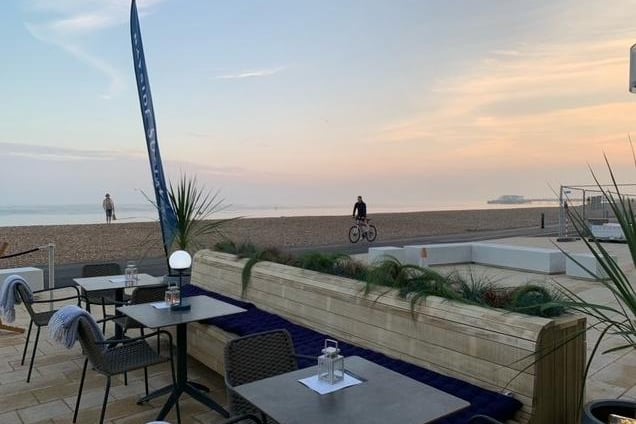 The outside seating area of Bayside Social has a stunning view of Worthing beach