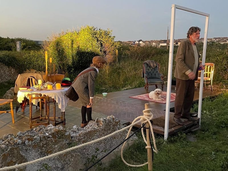 Actors portraying the Stationmaster and his son performing on the set of the Stationmaster’s cottage, created by scenic artist Romy Loughman and illustrator Rachel Cunningham (Photo: Rachel Cunningham)