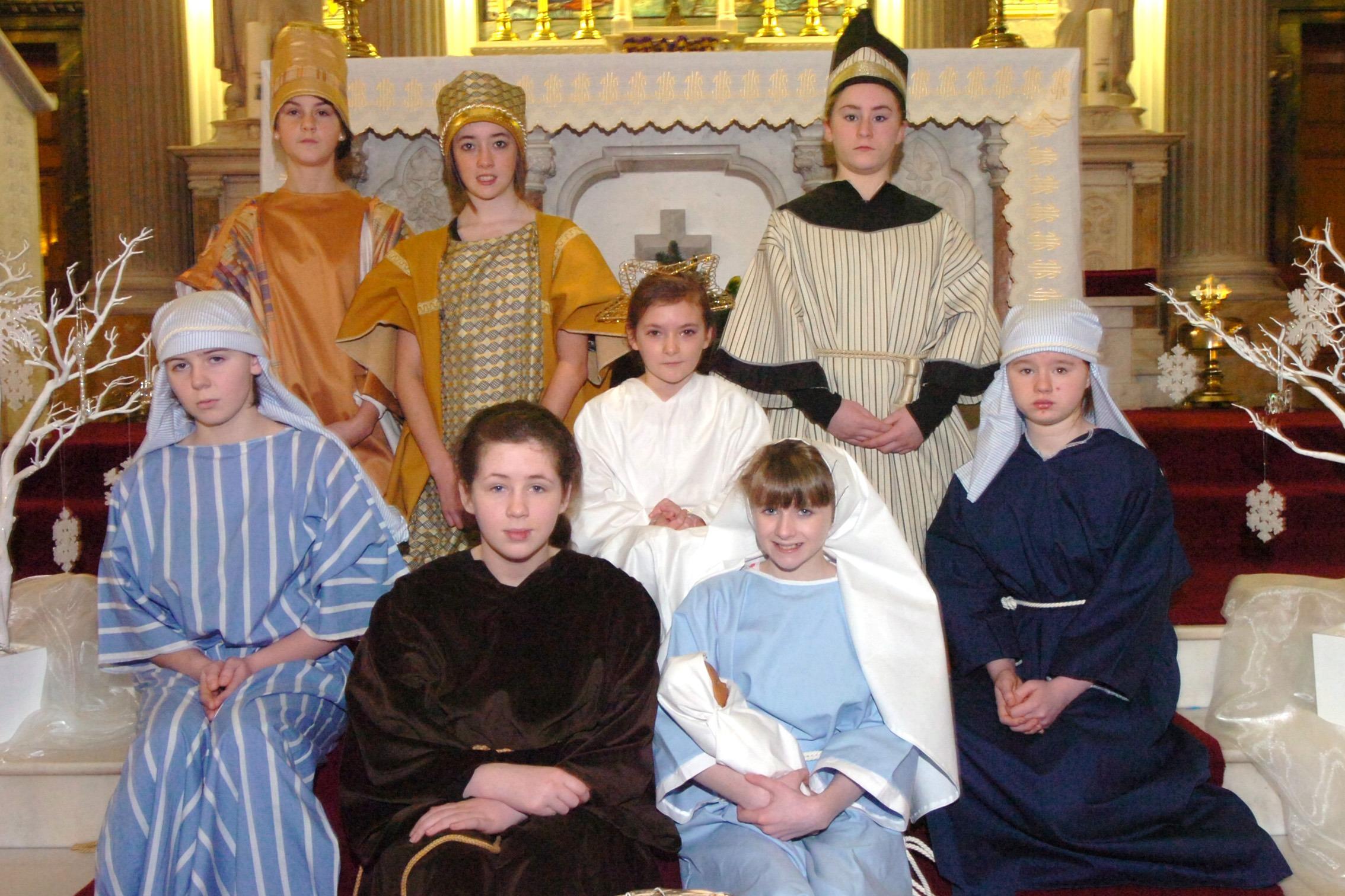 St Cecilia's College pupils who performed scenes from the Nativity during the carol service at Longtower Church. (2712PG02)