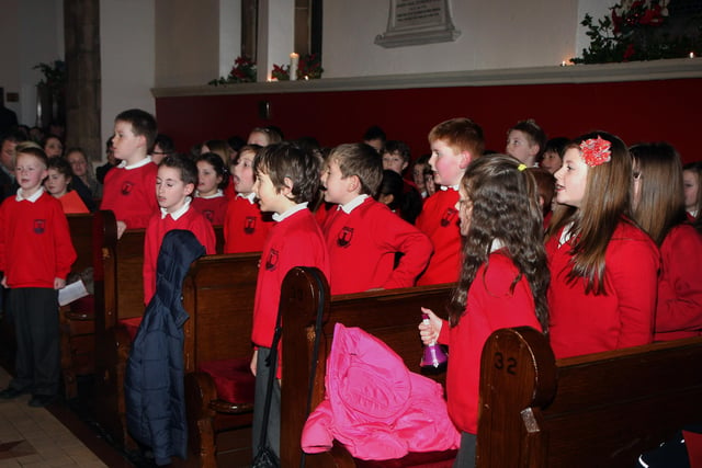 Members of the junior school choir, singing hymns at the Lisnagelvin Primary School’s annual Carol Service in All Saint’s Clooney Church.  INLS 5211-510MT.
