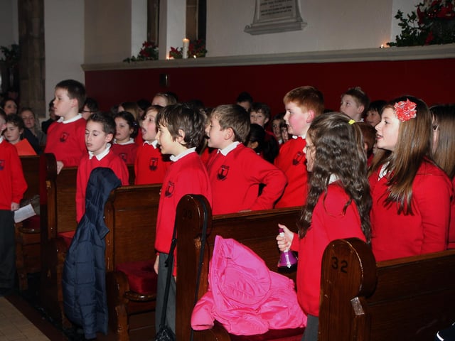 Members of the junior school choir, singing hymns at the Lisnagelvin Primary School’s annual Carol Service in All Saint’s Clooney Church.  INLS 5211-510MT.