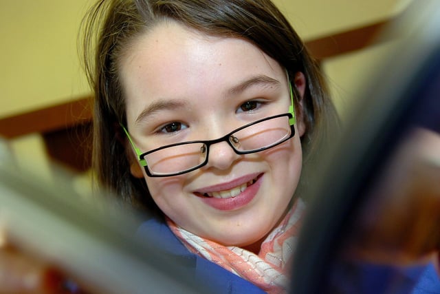 Kelsey had a smile for the photographer during her school's annual book fair back in 2010.
