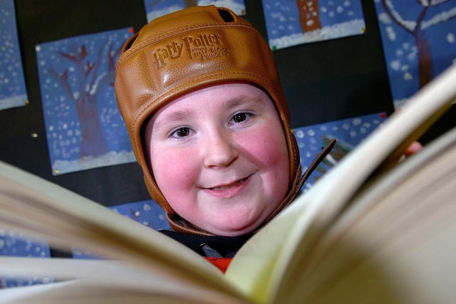 Maghera Primary School pupil Gavin engrossed in his Harry Potter book during the school's annual book fair in 2010.