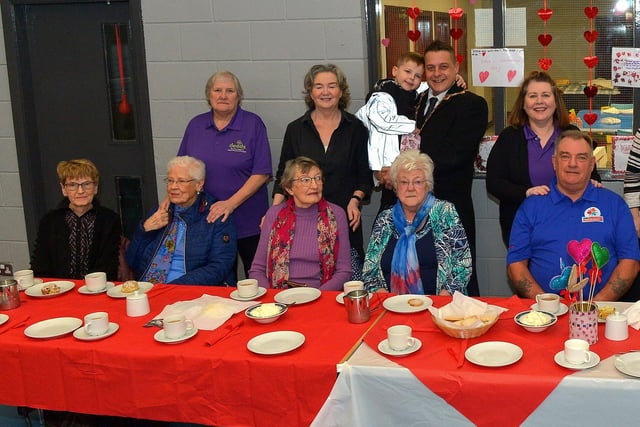 Mayor Alderman Graham Warke and his son Ollie pictured with members and volunteers of the Caw/Nelson Drive DEEDS group at the ‘Love-in-a-bucket’ Dementia Valentines Tea-Dance in Caw community Centre on Wednesday morning last. Photo: George Sweeney.  DER2207GS – 006