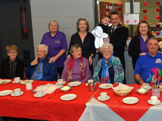 Mayor Alderman Graham Warke and his son Ollie pictured with members and volunteers of the Caw/Nelson Drive DEEDS group at the ‘Love-in-a-bucket’ Dementia Valentines Tea-Dance in Caw community Centre on Wednesday morning last. Photo: George Sweeney. DER2207GS – 006