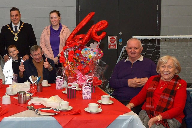Mayor Alderman Graham Warke and his son Ollie pictured with members and volunteers of the Shantallow DEEDS group at the ‘Love-in-a-bucket’ Dementia Valentines Tea-Dance in Caw community Centre on Wednesday morning last. Photo: George Sweeney.  DER2207GS – 003