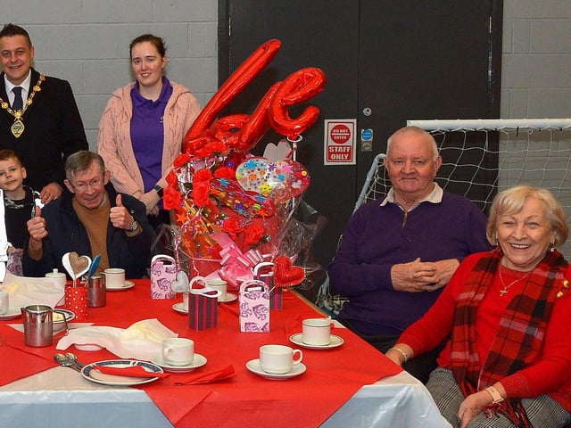 Mayor Alderman Graham Warke and his son Ollie pictured with members and volunteers of the Shantallow DEEDS group at the ‘Love-in-a-bucket’ Dementia Valentines Tea-Dance in Caw community Centre on Wednesday morning last. Photo: George Sweeney. DER2207GS – 003
