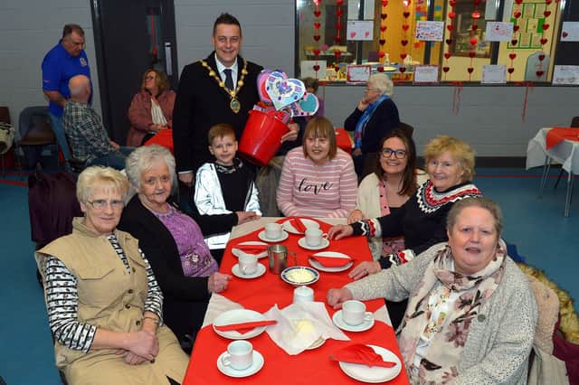 Mayor Alderman Graham Warke and his son Ollie pictured with members of the Hillcrest DEEDS group at the ‘Love-in-a-bucket’ Dementia Valentines Tea-Dance in Caw community Centre on Wednesday morning last. It’s the first DEEDS Dementia get together since the outbreak of COVID -19 in 2019. Photo: George Sweeney.  DER2207GS – 002