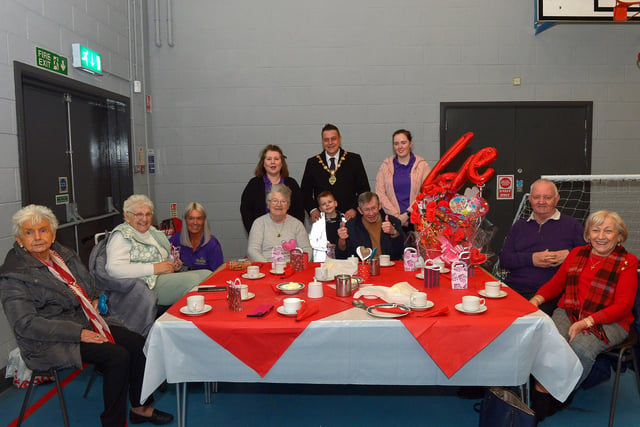 Mayor Alderman Graham Warke and his son Ollie pictured with members and volunteers of the Shantallow DEEDS group at the ‘Love-in-a-bucket’ Dementia Valentines Tea-Dance in Caw community Centre on Wednesday morning last. Photo: George Sweeney.  DER2207GS – 003