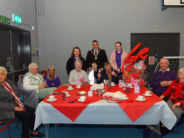 Mayor Alderman Graham Warke and his son Ollie pictured with members and volunteers of the Shantallow DEEDS group at the ‘Love-in-a-bucket’ Dementia Valentines Tea-Dance in Caw community Centre on Wednesday morning last. Photo: George Sweeney.  DER2207GS – 003