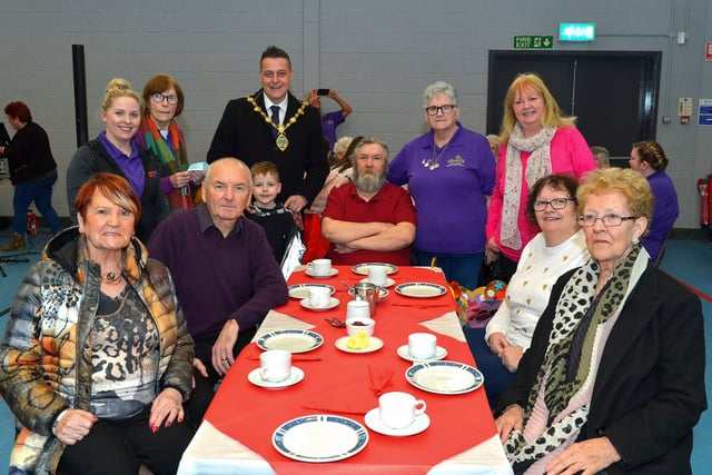 Mayor Alderman Graham Warke and his son Ollie pictured with members and volunteers of the Old Library Trust DEEDS group at the ‘Love-in-a-bucket’ Dementia Valentines Tea-Dance in Caw community Centre on Wednesday morning last. Photo: George Sweeney.  DER2207GS – 005