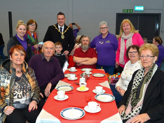 Mayor Alderman Graham Warke and his son Ollie pictured with members and volunteers of the Old Library Trust DEEDS group at the ‘Love-in-a-bucket’ Dementia Valentines Tea-Dance in Caw community Centre on Wednesday morning last. Photo: George Sweeney.  DER2207GS – 005