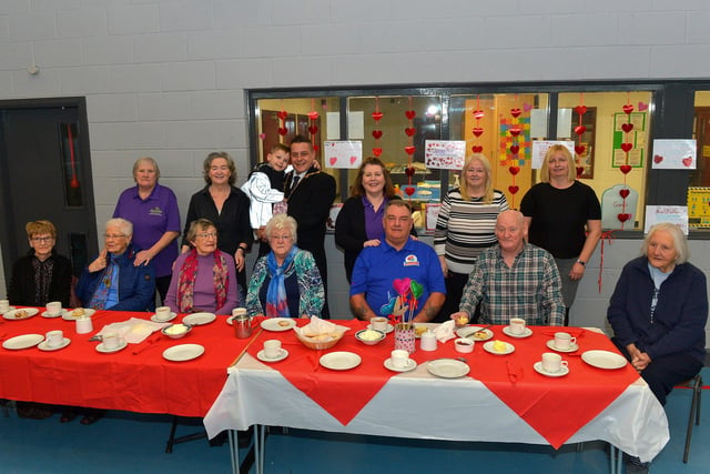 Mayor Alderman Graham Warke and his son Ollie pictured with members and volunteers of the Caw/Nelson Drive DEEDS group at the ‘Love-in-a-bucket’ Dementia Valentines Tea-Dance in Caw community Centre on Wednesday morning last. Photo: George Sweeney.  DER2207GS – 006