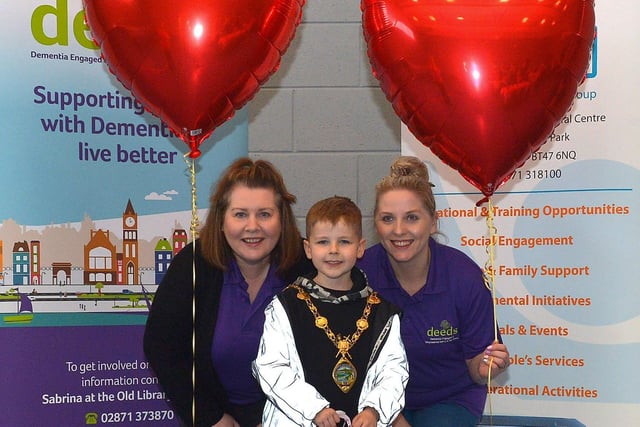 Junior Mayor Ollie Warke pictured with DEEDS volunteers Wendy McLaughlin and Leanne Harris at the ‘Love-in-a-bucket’ Dementia Valentines Tea-Dance in Caw community Centre on Wednesday morning last.  Photo: George Sweeney.  DER2207GS – 008
