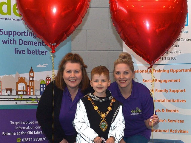 Junior Mayor Ollie Warke pictured with DEEDS volunteers Wendy McLaughlin and Leanne Harris at the ‘Love-in-a-bucket’ Dementia Valentines Tea-Dance in Caw community Centre on Wednesday morning last. Photo: George Sweeney. DER2207GS – 008
