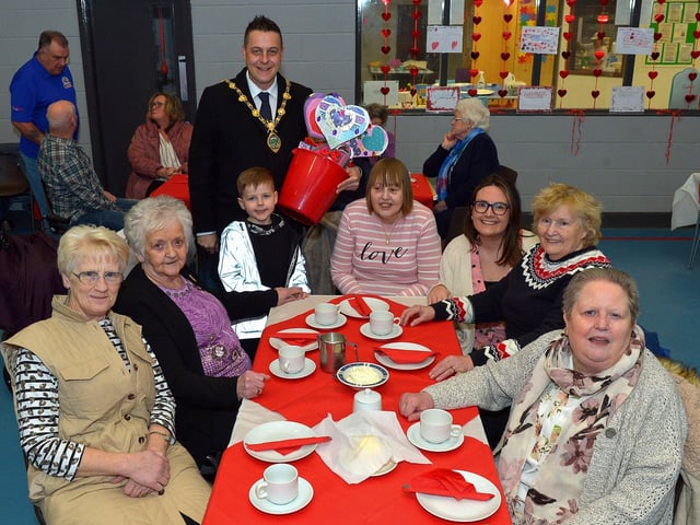 Mayor Alderman Graham Warke and his son Ollie pictured with members of the Hillcrest DEEDS group at the ‘Love-in-a-bucket’ Dementia Valentines Tea-Dance in Caw community Centre on Wednesday morning last. It’s the first DEEDS Dementia get together since the outbreak of COVID -19 in 2019. Photo: George Sweeney. DER2207GS – 002