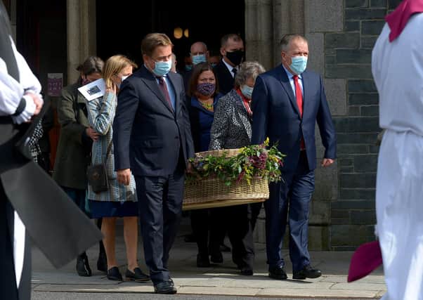 The coffin of Pat Hume is carried by her children from St Eugene’s Cathedral after Requiem Mass on Monday morning.  Photo: George Sweeney.  DER2136GS – 049