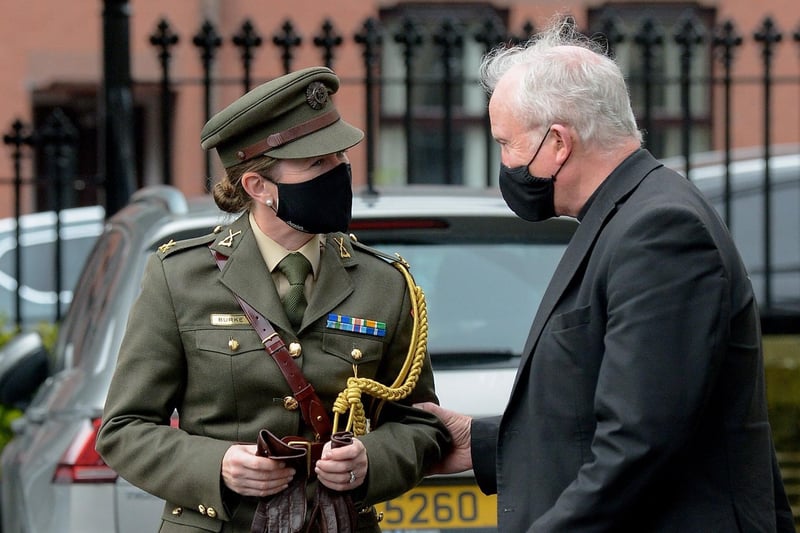 An Taoiseachâ€TMs Aide de Camp Commandant Caroline Burke speaking with the Most Reverend Dr Donal McKeown, Bishop of Derry, at the funeral of Pat Hume in St Eugeneâ€TMs Cathedral on Monday morning.  Photo: George Sweeney.  DER2136GS â€“ 062