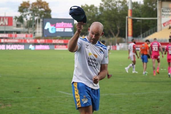 Rohan Smith salutes the travelling fans after 12-man Rhinos' golden-point win at Catalans last July. Picture by Manuel Blondeau/SWpix.com.