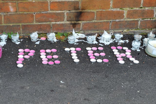 Candles spelling out 'Peter' have been left at the scene.