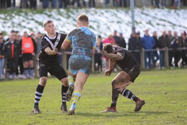 Stanningley's defence halt Newcastle Thunder's Evan Lawther during the sides' third round tie. Picture by Alex Shenton.