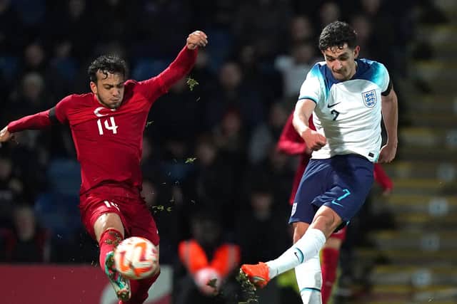 England's Sonny Perkins (right) attempts a shot which is blocked by Turkey's Ali Sahin Yilmaz during the UEFA U19 European Championship Elite Qualifying match at the Technique Stadium, Chesterfield. (Pic: PA)