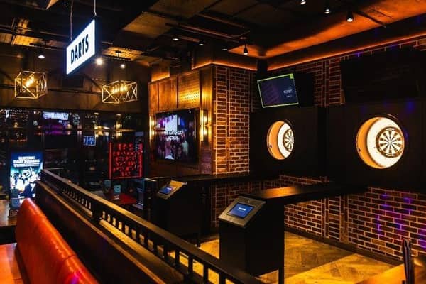 Challenge friends to electric darts or shuffleboard