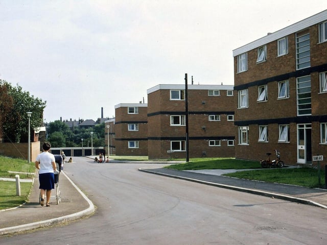 New flats on the site of Jackson Lane which by the time that this photograph was taken had been renamed Bank Avenue. The road off to the bottom left followed the route of Cross Church Street, but the entrance into Bank Street at the bottom of Jackson Lane (Bank Avenue) had been blocked off by the garages at the bottom of the street in this picture. The main road turned right just before where the children are playing and came out into Bank Street opposite the Club Field Steps (i.e. behind the Conservative Club). The only way out by car was into Bank Street and then Brunswick Street.