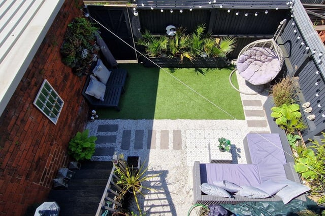 The rear garden is enclosed and thoughtfully landscaped. A delightful patio area provides the perfect space for outdoor entertaining and al fresco dining.