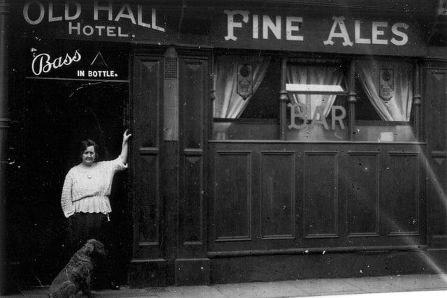 In the doorway of this undated photo is landlady Mary Smith, formerly Ibberson, with her dog.