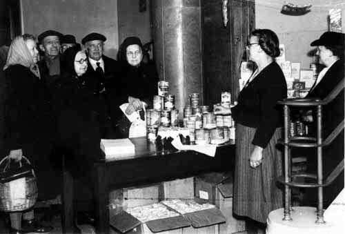 Pensioners receive overseas food gifts at Rothwell Council Offices in December 1949.