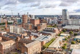An aerial panoramic view of the Leeds skyline.