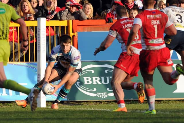 Tom Briscoe scores one of his three tries on debut for Rhinos at Hull KR in February, 2014. Picture by Simon Hulme.