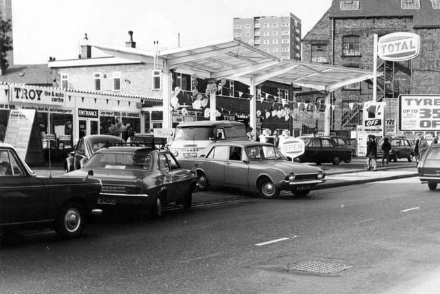 The shop is in the background, left, while the adjoining taller building to the right of it is the Tyre Discount Centre where new tyres are fitted. In the background, high rise flats in Burnsall Grange are visible, built in 1966 off Theaker Lane.