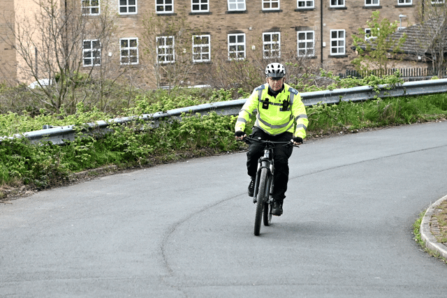 PCSO Graham Dyson on his bike.